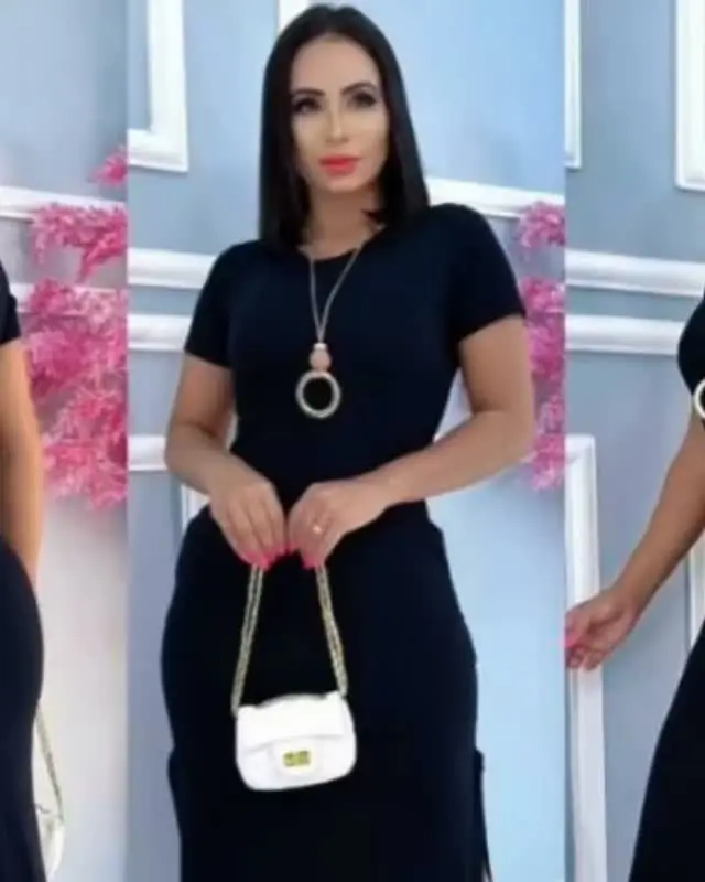 Modelo com vestido midi preto de manga curta